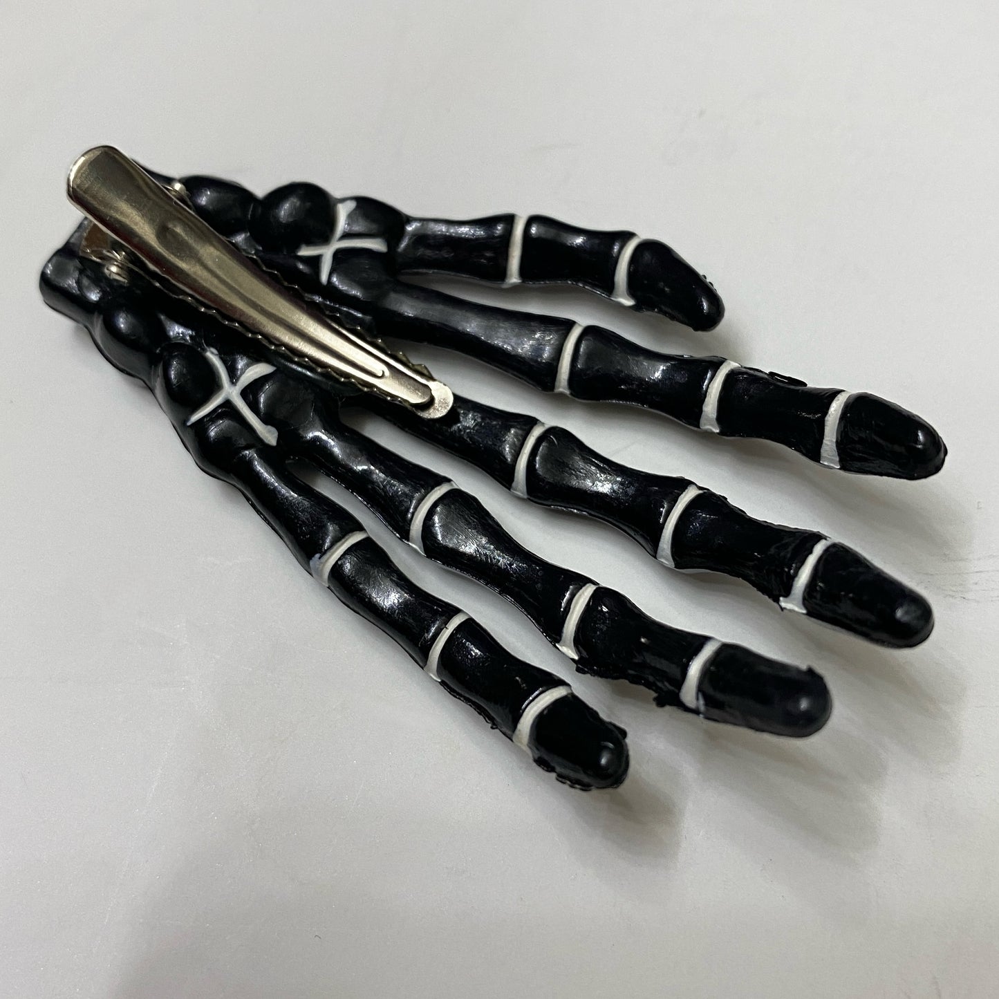 Black + white Skeleton Hand Hair Clip