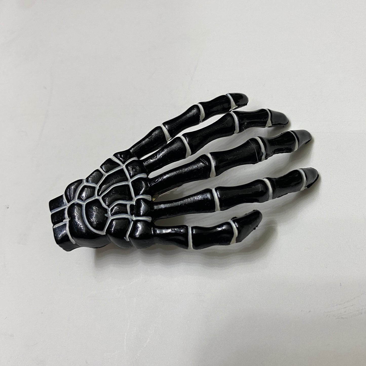 Black + white Skeleton Hand Hair Clip