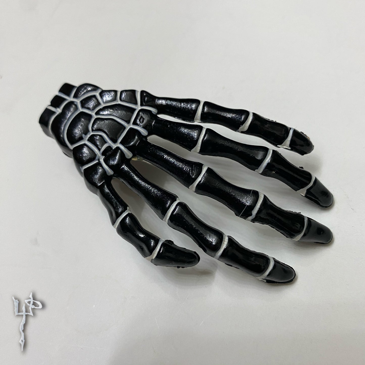 Black + white Skeleton Hand Hair Clip
